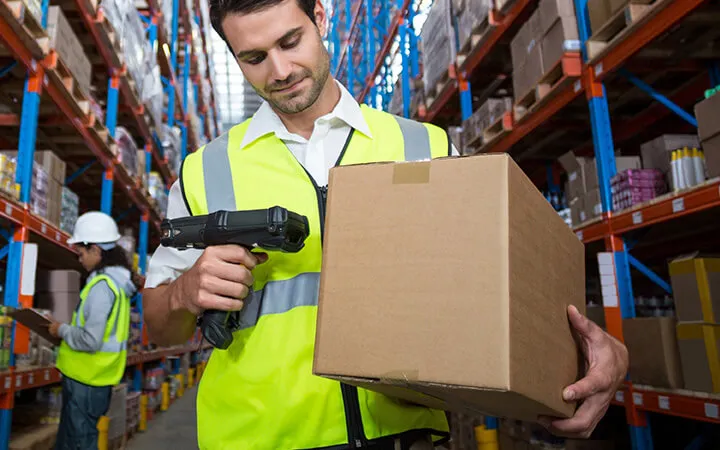 Man scanning label on shipping box